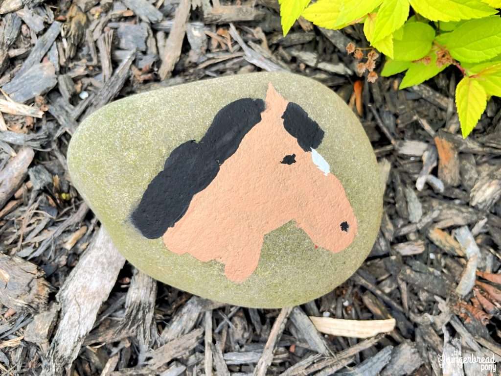 horse head painted on rock
