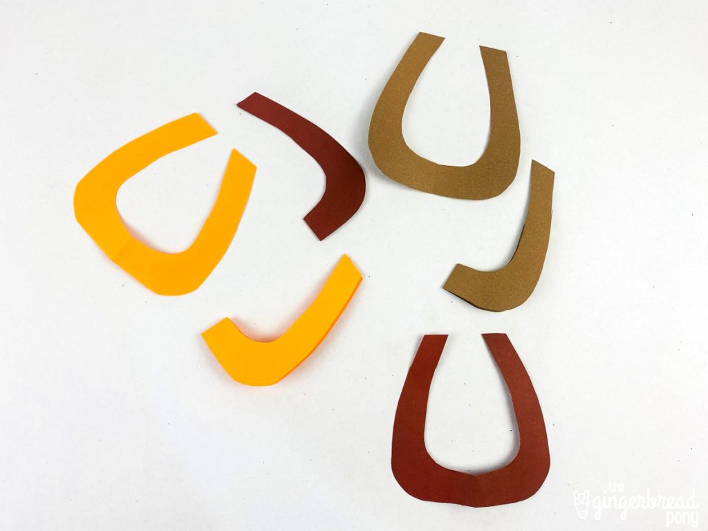 Folded paper horse shoes